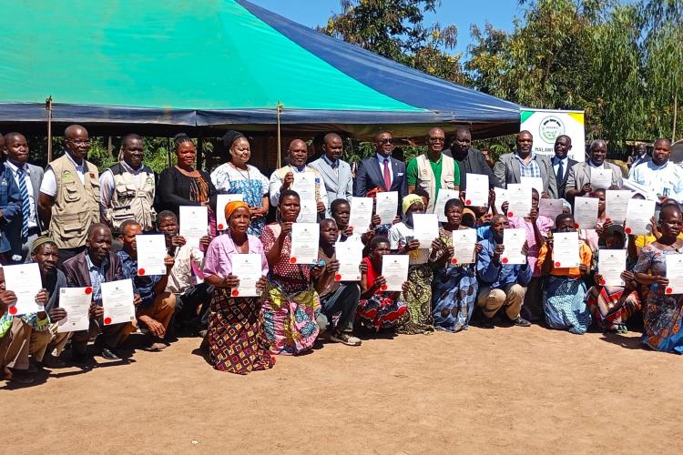  Land owners posing for a group photo with the Minister